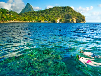 Couple snorkelling in Bluegreen waters of St Lucia
